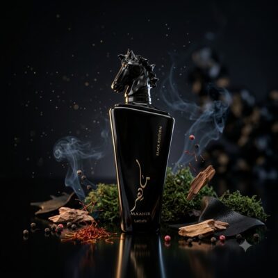 Maahir Black Edition de Lattafa Perfumes, perfume oriental especiado unisex con azafrán, cuero, pachulí, cedro y almizcle, fragancia intensa y elegante.